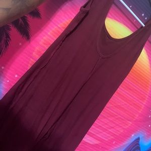 Red body suit with rips down the front of the leg